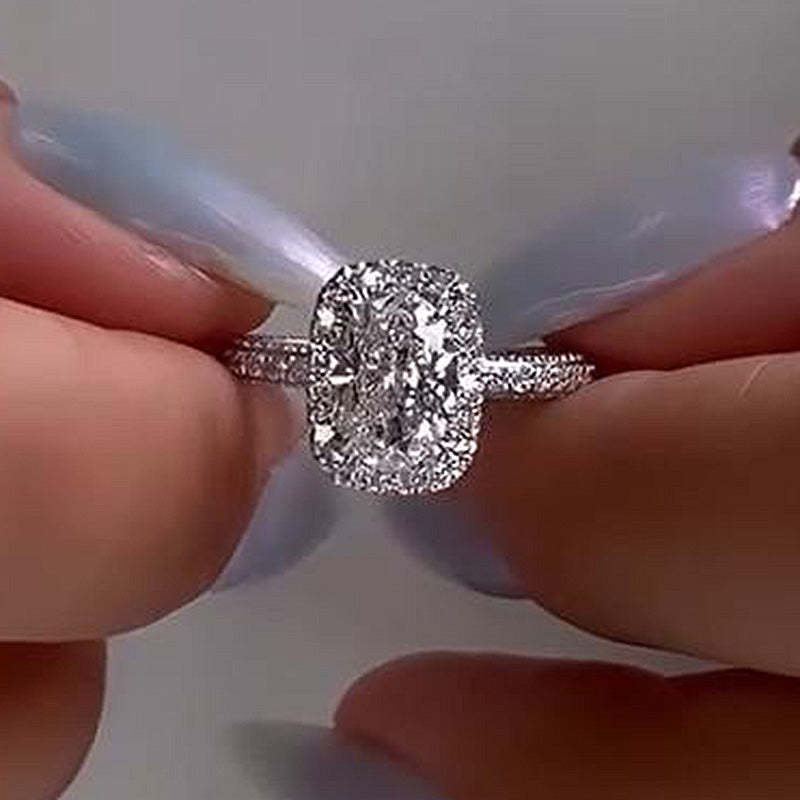 Exquisite Halo Oval Cut Engagement Ring In Sterling Silver