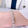 Two Tone X Round Cut Bracelet in Sterling Silver