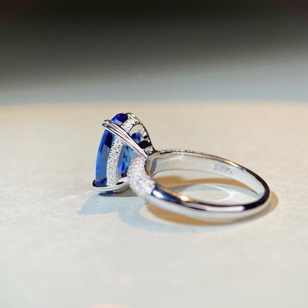 Oval Cut Blue Under Halo Sterling Silver Engagement Ring